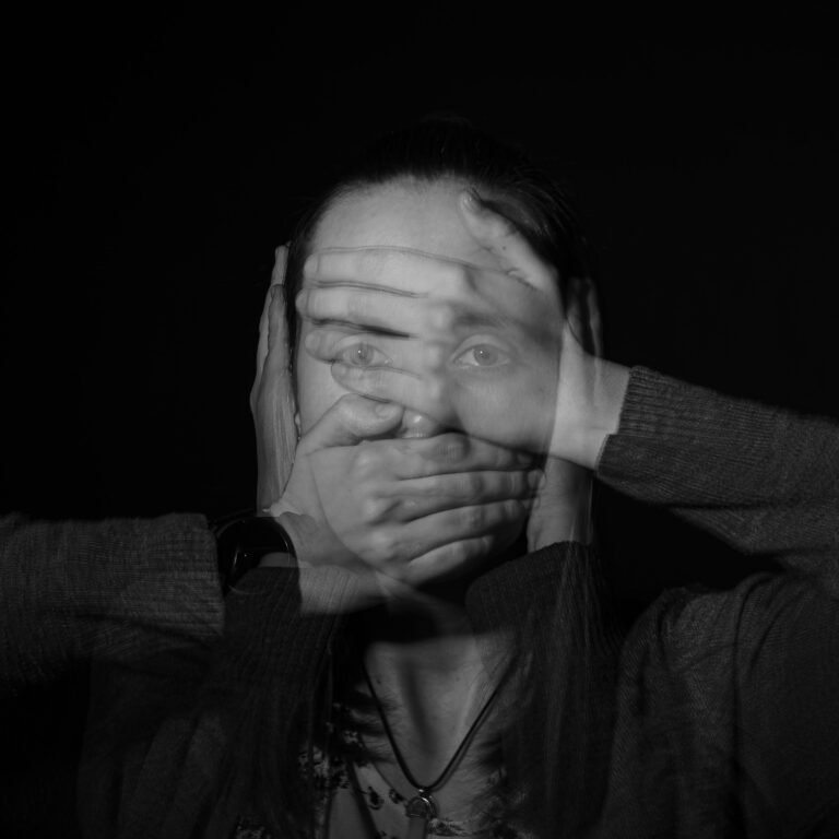 Can Meditation Help Anxiety - Image of a woman with her hands over her face and ears