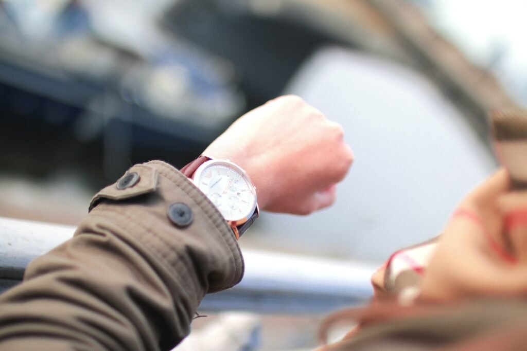 How Long Does Meditation Take to Work. A man looks at his watch.